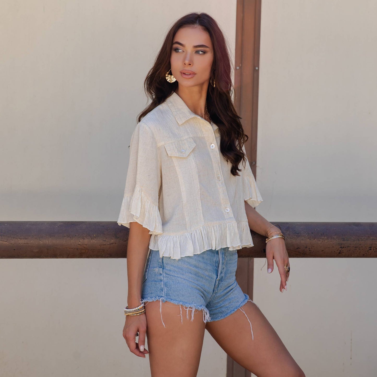 Distressed Denim Crop Jacket with Ruffled Hem