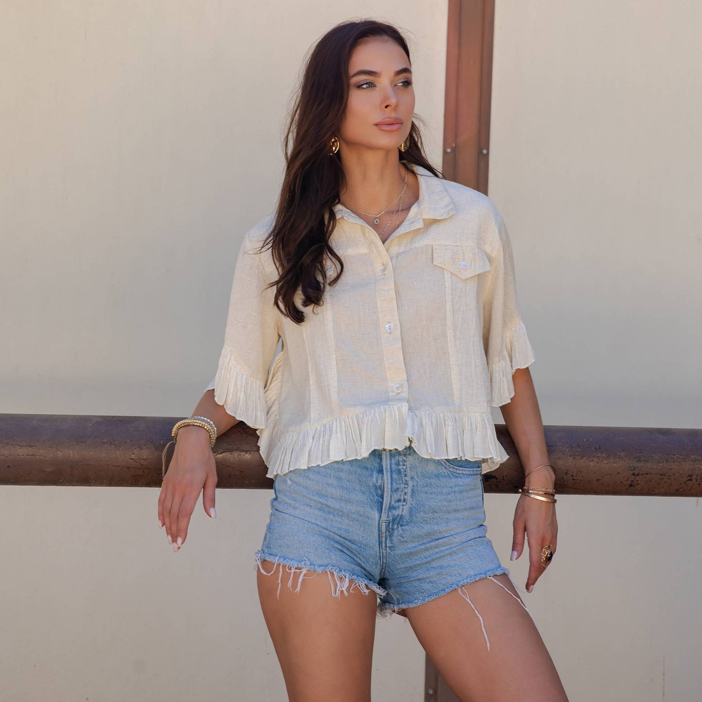 Distressed Denim Crop Jacket with Ruffled Hem