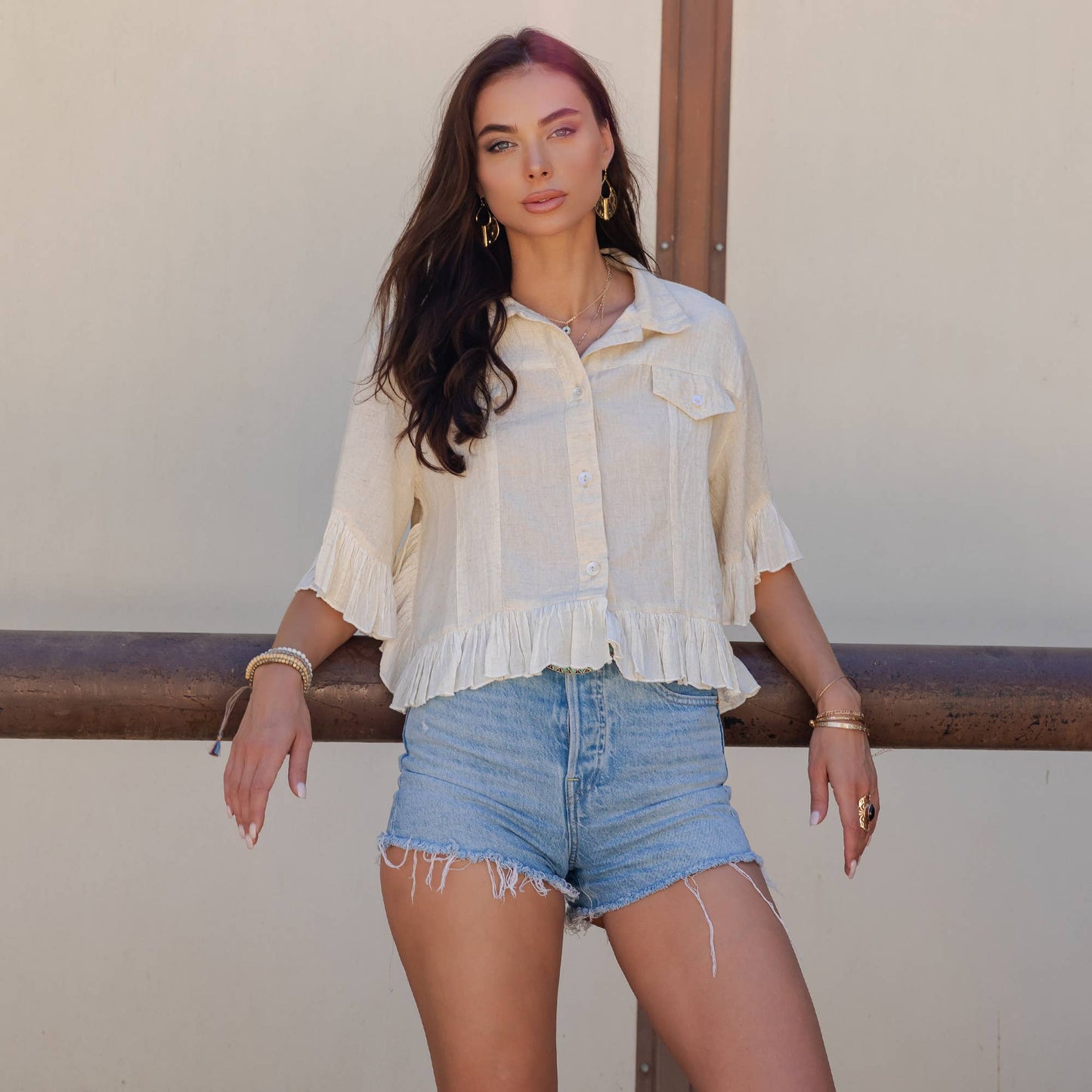 Distressed Denim Crop Jacket with Ruffled Hem