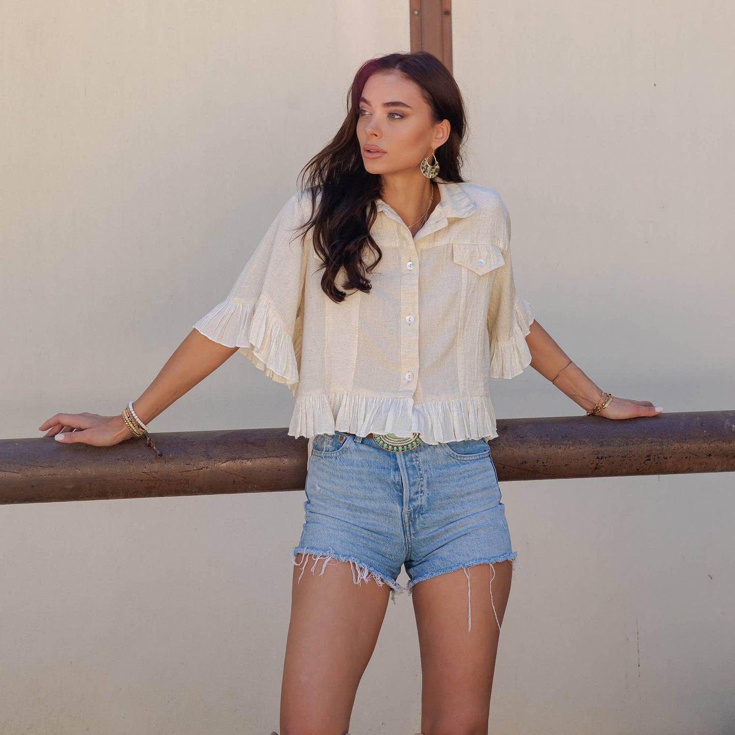Distressed Denim Crop Jacket with Ruffled Hem